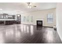 Open living room with hardwood floors and fireplace at 189 Aylesbury Blvd, Mcdonough, GA 30252
