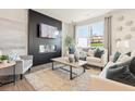 Bright living room featuring a modern fireplace and comfortable seating at 1947 Westwind Street (Lot 163), Lawrenceville, GA 30043