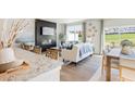 Open concept living and dining with hardwood floors and access to patio at 1947 Westwind Street (Lot 163), Lawrenceville, GA 30043