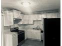 Updated kitchen featuring stainless steel appliances and white cabinets at 201 Peyton Sw Pl, Atlanta, GA 30311