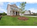 Charming two-story home with brick accents, manicured lawn, and inviting front porch at 1646 Tide Mill Rd, Cumming, GA 30040