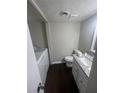 Small bathroom with granite vanity, toilet and washer-dryer at 1867 Myrtle Sw Dr # 26, Atlanta, GA 30311