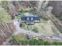 Aerial view of house, driveway, and surrounding trees at 2006 Goode Rd, Conyers, GA 30094