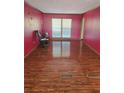 Bright living room featuring hardwood floors and large windows at 2006 Goode Rd, Conyers, GA 30094