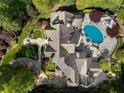 Expansive estate featuring a luxurious pool, manicured gardens, and a grand residence at 3685 Paces Ferry Nw Rd, Atlanta, GA 30327