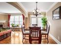 Bright dining room with hardwood floors, chandelier, and access to patio at 4429 Wilkerson Manor Se Dr, Smyrna, GA 30080