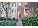 Attractive brick townhome with manicured landscaping and walkway at 4429 Wilkerson Manor Se Dr, Smyrna, GA 30080