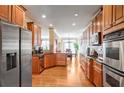 Spacious kitchen with hardwood floors, stainless steel appliances, and wood cabinets at 4429 Wilkerson Manor Se Dr, Smyrna, GA 30080