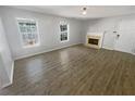 Spacious living room featuring hardwood floors and a fireplace at 5431 Village Green Sq # 1018, Norcross, GA 30093