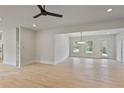 Spacious dining room with hardwood floors and a modern chandelier at 113 Creekview Ln, Canton, GA 30115