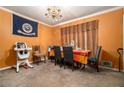 Dining room with a table for four and orange walls at 3059 Sorrento Sw Cir, Atlanta, GA 30331