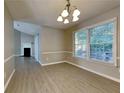 Bright dining area with hardwood floors and a chandelier at 2065 Arbor Forest Sw Dr, Marietta, GA 30064