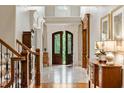 Grand two-story entry with hardwood floors and wood staircase at 830 Camden Park Ne Ct, Atlanta, GA 30342