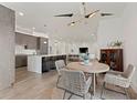Modern dining area with a round table, woven chairs, and a stylish light fixture at 1494 Red Fox Ne Dr # D, Atlanta, GA 30306