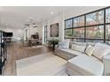 Bright living room featuring hardwood floors, large windows, and comfortable seating at 1494 Red Fox Ne Dr # D, Atlanta, GA 30306