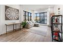 Cozy living area with hardwood floors, large windows, and a comfortable sectional sofa at 1494 Red Fox Ne Dr # D, Atlanta, GA 30306