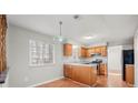 Efficient kitchen featuring wood cabinets and modern appliances at 620 Sheringham Ct, Roswell, GA 30076