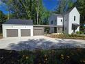 Home with a three car garage and spacious driveway at 135 Cedarwood Ln, Roswell, GA 30075