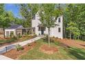Beautiful two-story home boasting a modern design and meticulously landscaped grounds at 135 Cedarwood Ln, Roswell, GA 30075