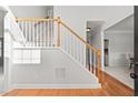 Elegant staircase with wood and carpet accents complemented by neutral wall color at 1515 Bullard Pl, Powder Springs, GA 30127