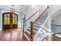 Elegant hardwood staircase with black metal balusters at 1393 Lanier Pl, Atlanta, GA 30306