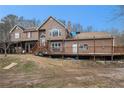 Two story house with wrap around deck, and screened porch at 1275 Poole Bridge Rd, Hiram, GA 30141