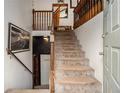 Entrance staircase with carpeted steps and wooden railing at 1275 Poole Bridge Rd, Hiram, GA 30141