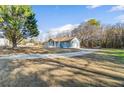 Ranch home with gravel driveway at 900 Stone Lea Trce, Oxford, GA 30054