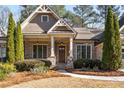 Craftsman style home with brick facade and stone accents at 5905 Kayron Dr, Atlanta, GA 30328