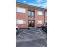 Modern apartment building entrance with black doors and brick facade at 1705 Monroe Ne Dr # B05, Atlanta, GA 30324