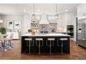 Modern kitchen featuring white cabinets, an island, and stainless steel appliances at 2675 S Bamby Ne Ln, Brookhaven, GA 30319