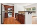 Stainless steel appliances and dark wood cabinets in kitchen at 3136 Mercer University Dr # 6, Chamblee, GA 30341