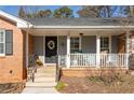 Inviting front porch with rocking chairs and wreath at 2384 Bradcliff Ne Dr, Atlanta, GA 30345