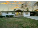 Charming white brick house with yellow front door and updated features at 679 Montevista St, Atlanta, GA 30310