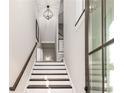 Elegant staircase with dark wood treads and white risers at 207 Mitchell Ln, Woodstock, GA 30188