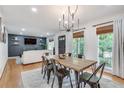 Open concept dining area with wood table and access to living room at 3839 Redbud Se Ct, Smyrna, GA 30082