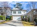 Two-story house with white siding, stone accents, and a two-car garage at 2603 Apple Valley Ne Rd, Brookhaven, GA 30319