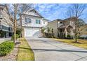 Two-story house with white siding, stone accents, and a two-car garage at 2603 Apple Valley Ne Rd, Brookhaven, GA 30319