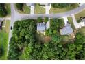 Aerial perspective of house nestled in a wooded neighborhood at 12 Spruce Ne St, White, GA 30184