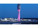 Airport control tower and airplanes on the tarmac at night at 4266 Sw Notting Hill Dr # 28, Atlanta, GA 30331