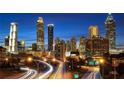 Atlanta cityscape at night, featuring skyscrapers and highway at 4266 Sw Notting Hill Dr # 28, Atlanta, GA 30331