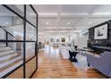 Open concept living space with hardwood floors, fireplace, and modern furniture at 2571 Sharondale Ne Dr, Atlanta, GA 30305