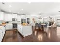 Spacious kitchen with white cabinets, granite counters, and stainless steel appliances at 164A Goshen Ln, Woodstock, GA 30188