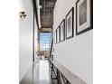 Bright hallway with modern art, metal shelving, and large window letting in lots of light at 170 Boulevard Se # E411, Atlanta, GA 30312