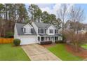 Two-story house with gray roof, white siding, and black shutters at 3012 Lexington Ave, Woodstock, GA 30189