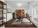 Home office with built-in shelving and hardwood floors at 3012 Lexington Ave, Woodstock, GA 30189