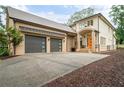 Contemporary home with two-car garage and landscaped front yard at 4225 Maner Street Se, Smyrna, GA 30080