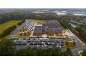 Aerial view of school campus with large parking lot and school buses at 6711 Witherington Ct, Norcross, GA 30093