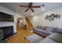 Spacious living room with hardwood floors, fireplace and sectional sofa at 6711 Witherington Ct, Norcross, GA 30093