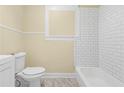 Renovated bathroom with white subway tile and a classic bathtub at 776 Brookline Sw St, Atlanta, GA 30310